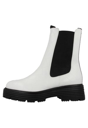 White quilted leather ankle boot with a black elastic panel, rounded toe, and a chunky black rubber sole. Side pull tab included.