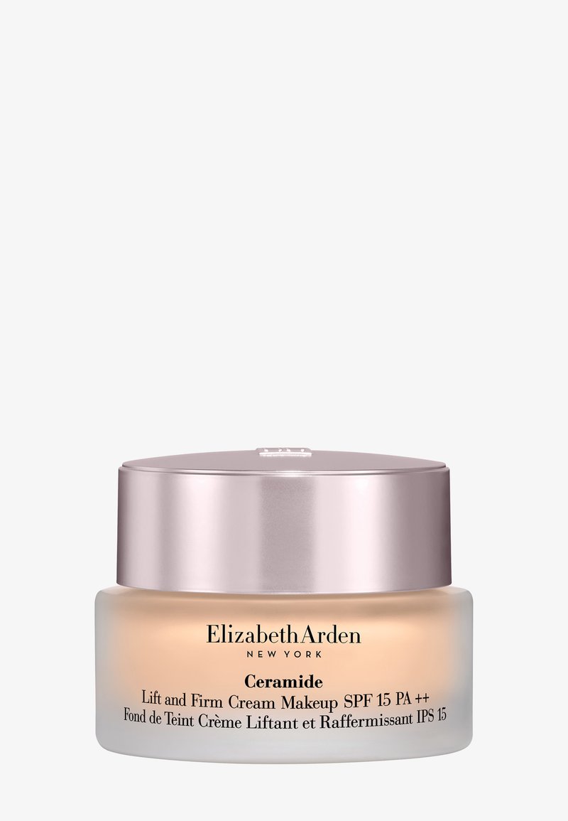Tarro de crema de maquillaje Elizabeth Arden Ceramide Lift and Firm con SPF 15, con envase de vidrio esmerilado y tapa metálica rosa.