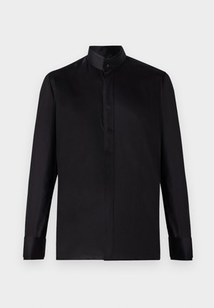 Zwarte longsleeve shirt met staande kraag, gemaakt van gladde stof, met knoopmanchetten en een schoon, minimalistisch ontwerp.