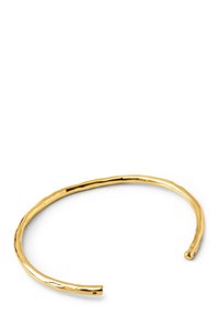 Bracciale in oro con un design ondulato e testurizzato. Le estremità aperte e una finitura lucida e raffinata enfatizzano il suo stile minimalista.