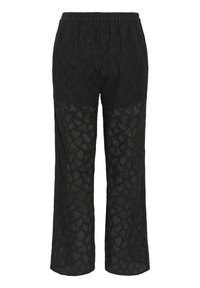 Svarta spetsbyxor med elastisk midja, vida ben och en texturerad mönstring med geometriska former.