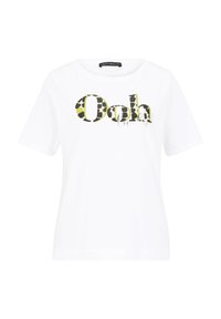 T-shirt blanc à manches courtes avec col rond présentant le texte "Ooh la la !" en lettres noires et vertes à motifs. Texture de tissu douce.