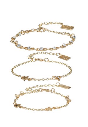 Auksinės spalvos apyrankės trijuose stiliuose, su grandinėmis, kristalais ir žvaigždžių akcentais. Išskirtiniai detalės apima krabų užsegimus ir etiketės.