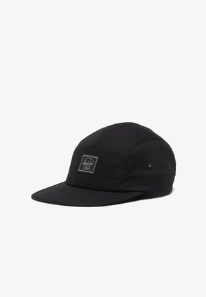 Black cap made of polyester, featuring a curved brim, six-panel design, and a front logo patch. Includes ventilation eyelets on sides.