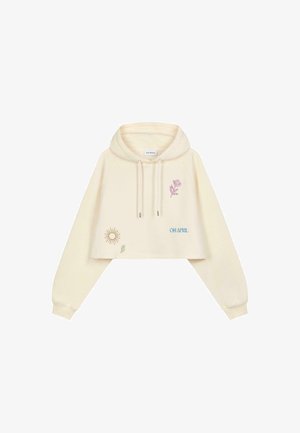 Kort, crèmekleurige hoodie met een trekkoordcapuchon; heeft bloemen- en zonmotieven in lila en blauw; zachte textuur en comfortabel model.