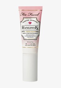 Too Faced Hangover RX Replenishing Face Primer in a pink and white tube. Features gold accents, with text detailing ingredients and benefits.
