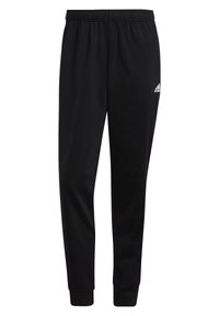 Schwarze Jogginghose mit elastischem Bund. Schmal zulaufendes Bein-Design, mit einem kleinen weißen Adidas-Logo nahe der linken Hüfte. Weicher Stoff.