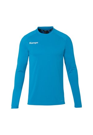 Blauw sportshirt met lange mouwen, ronde hals en wit "Kempa" logo op de bovenste linkerkant van de borst.