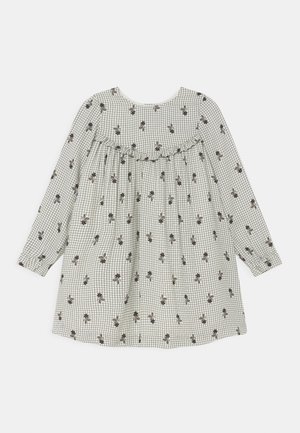 Vestido de mangas compridas feito de um tecido leve com um padrão xadrez e detalhes florais. Apresenta um decote franzido e um corte solto.