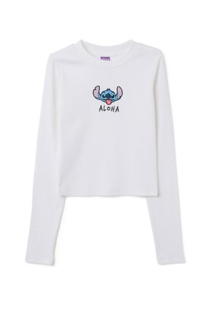 T-shirt court à manches longues blanc en tissu côtelé, avec un personnage bleu brodé et le texte "ALOHA" en dessous.