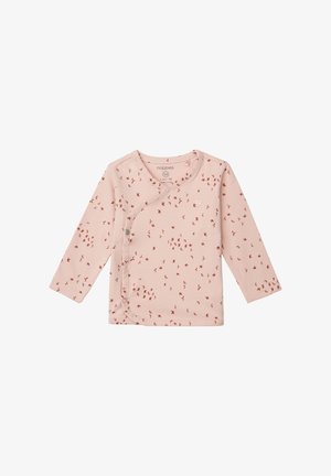 Roze langwerpige top van zacht katoen, met een wikkeldesign en kleine rode vogelpatronen. Drukknopen aan de zijkant.
