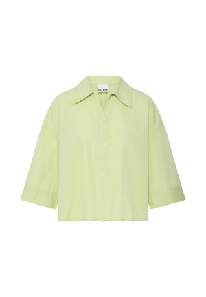 Chemise à manches courtes vert clair, boutonnée, col large et coupe ample, avec étiquette de la marque ICHI à l'intérieur du col.