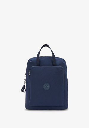 Navy blue backpack made of nylon with a front zipper pocket, top handles, and a logo patch. Features a decorative charm.