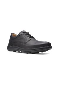 Schwarze Lederschuhe mit glatter Oberfläche, runder Zehenform, drei Ösen und strukturierten Akzenten an der Seite. Gummisohle mit Profil.