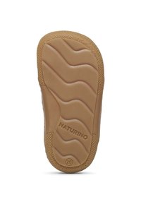 Light brown sole with a textured grip pattern, featuring wavy lines and the brand name "NATURINO" embossed near the heel. Size 20.
