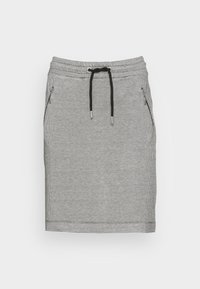 Gonna a quadretti bianco e neri con vita elastica e lacci regolabili, dotata di due tasche laterali con zip e una forma dritta.