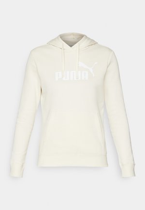 Sudadera color crema hecha de una tela suave, con un bolsillo canguro, capucha con cordón y el logo blanco de "PUMA" en la parte frontal.