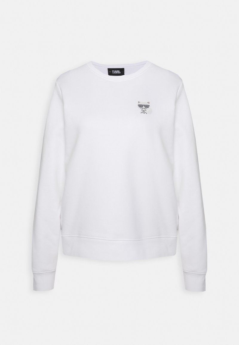 Felpa bianca con girocollo, maniche lunghe, polsini e orlo a coste, con una piccola grafica di un gatto in nero e grigio sul petto.