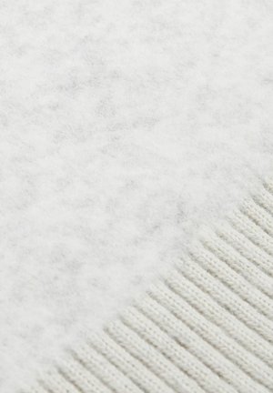 Zacht wit wollen stof met een gestructureerde afwerking, voorzien van een ribbelrand en een vachte, iets pluizige uitstraling.