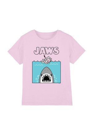 Light pink t-shirt featuring a cartoon shark and swimmer in turquoise water, with bold "JAWS" text above. Cotton fabric, relaxed fit.