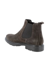 Stivale Chelsea in suede marrone con pannelli elastici laterali e linguetta. Suola in gomma con battistrada testurizzato per una presa migliore. Finiture a cucitura lungo i bordi.