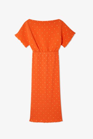 Narancssárga, rövid ujjú ruha, rugalmas derékkal és diszkrét arany pöttyös mintával. A nyújtott bordás textúra kiemeli az árnyékos sziluettet.
