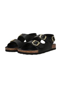 Svarta sandaler med två justerbara spännen, övre i konstläder, korkfotbädd och en texturerad gummiyttersula.