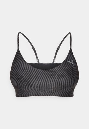 Brassier sport negru cu bretele subțiri, având un model subtil cu dungi și un logo. Fabricat dintr-un material neted și elastic pentru confort și suport.