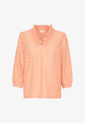 Barack színű blúz fodros V-kivágással, hosszú ujjakkal, elasztikus mandzsettával, és texturált hullámos mintával az egész anyagon.