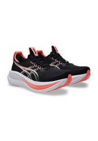 Black running shoes with a textured upper, featuring pink accents, sleek design, and a curved white midsole for cushioning.