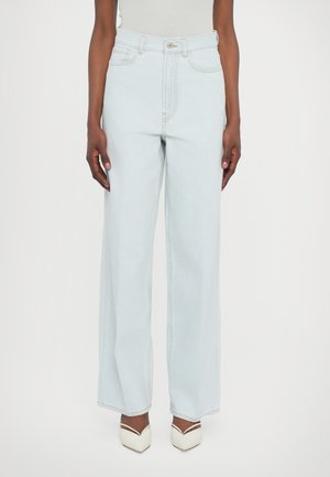 Light blue high-waisted wide-leg jeans made from denim, featuring contrast stitching, a button closure, and front pockets.