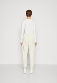 GAP HERITAGE JOGGER - Treniņtērpa apakšdaļas - oatmeal heather
