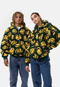 Karl Kani SIGNATURE SMILEY FULL ZIP UNISEX - Bunda z nepravej kože - green/yellow/black
