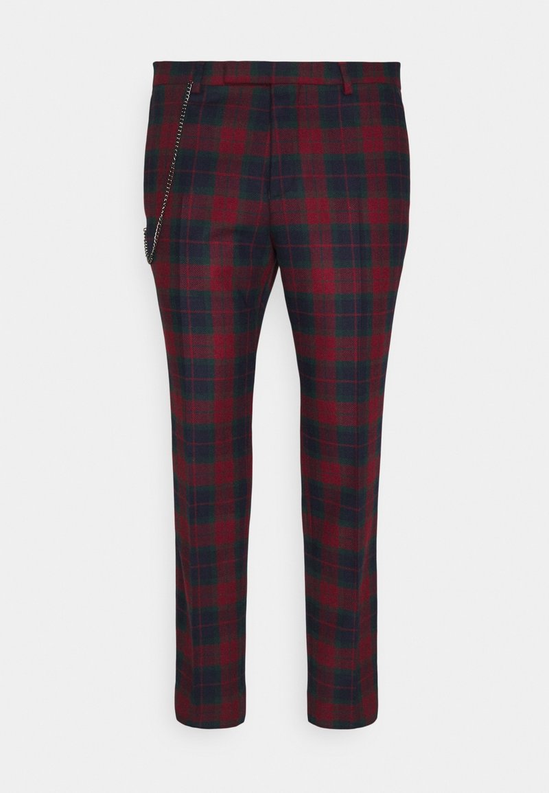 Plaid trousers featuring a red and dark green pattern, made of textured fabric. Includes a side chain detail for added functionality.
