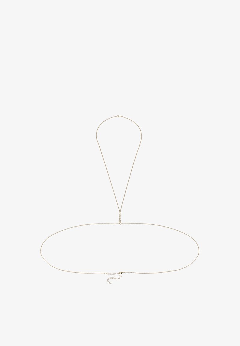 Collana in metallo dorato con un design elegante e minimalista, dotata di un anello allungato e lunghezza regolabile. I link testurizzati aggiungono dettagli.