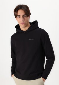 Calvin Klein ENLARGED BACK LOGO HOODIE - Majica s kapuljačom - black