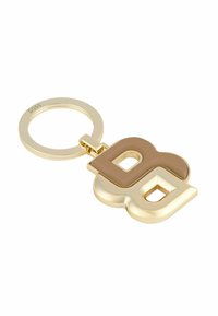 Gold-tone keychain featuring interconnected block letters 'B' and 'G' in brown and beige. Smooth finish with a round keyring attachment.