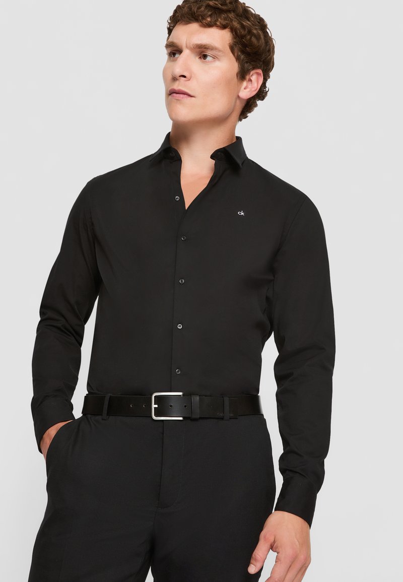 slim fit dress slacks Calvin Klein Men Non-Iron Slim Fit Dress Shirt