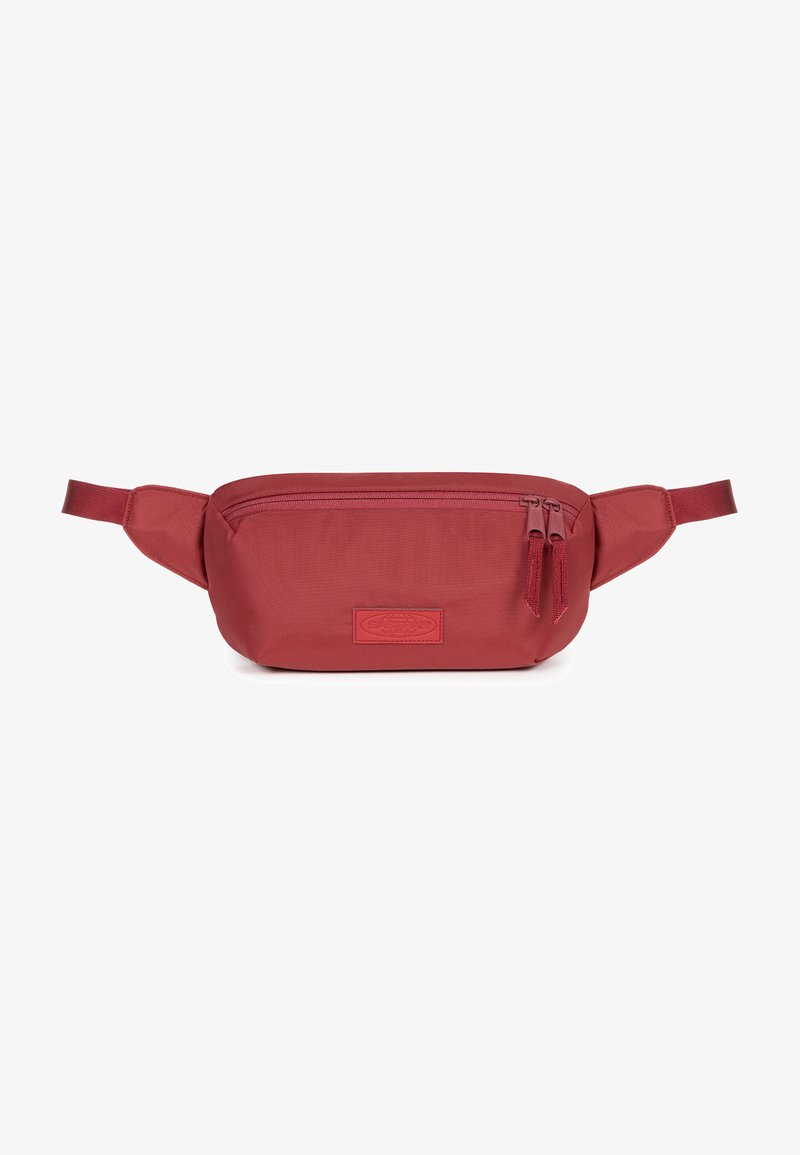 Röd tyg midjeväska med rundad form, dubbel dragkedjestängning och ett märkespatch. Har justerbara remmar för säker bärning.