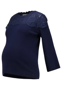 Blusa de maternidad azul marino con un encaje en el escote, mangas de tres cuartos y un corte ajustado para mayor comodidad.