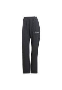 Pantalons de sport noirs avec une taille élastique, coupe fuselée et poche latérale. Présente un logo TERREX blanc sur la cuisse gauche.