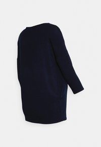 Navy blue oversized sweater, made of soft knit fabric, featuring a round neckline and three-quarter length sleeves. Smooth texture, minimal details.