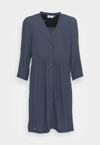 Mörkblå knä-length klänning med trekvartsärmar, knappstängning fram, insydd midja och rund halsringning med en lätt V-öppning.