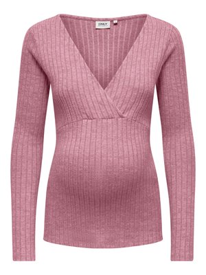Nosečniška majica v mehki rožnati rebrasti tkanini, z V-izrezom, dolgimi rokavi in prilagojeno zasnovo pasu za udobje in oporo.