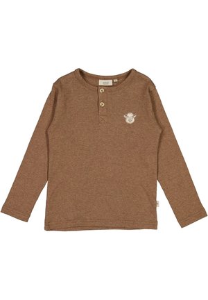 Chemise marron à manches longues en tissu côtelé, avec deux boutons au col et un petit patch en forme de visage d'agneau sur la poitrine gauche.