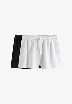 Zwei Paar Baumwollshorts, ein weißes mit vorderem Kordelzug und ein schwarzes, beide mit elastischem Bund und seitlichen Taschen.
