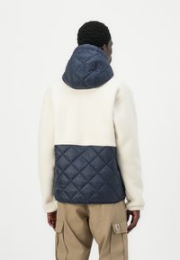 Helly Hansen STOWE HOODED HYBRID JACKET UNISEX - Zimní bunda - navy