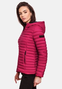 Fitted, hooded puffer jacket in bright pink with quilted texture, side zip pockets, and logo patch on the sleeve.