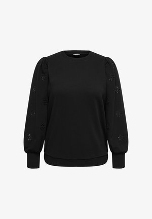 Črna majica z dolgimi, napihnjenimi rokavi s cvetličnimi izrezki. Mehka tkanina, okrogel izrez in rebrasti manšeti ter spodnji rob.