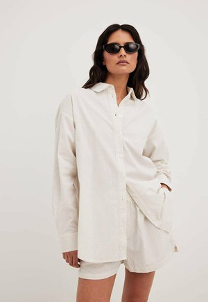 SEERSUCKER MIT LANGEN ÄRMELN - Button-down blouse - beige stripe